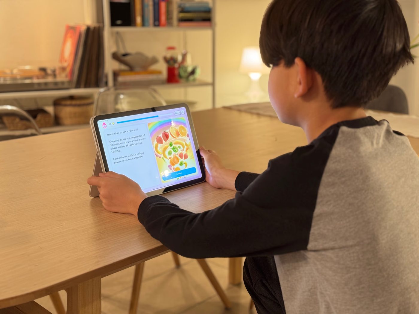 A child exploring a Sparkli lesson on a tablet